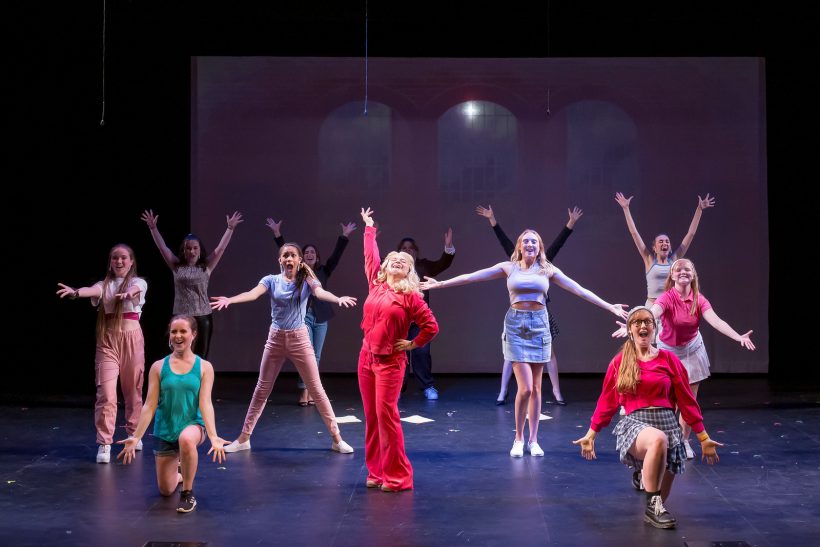 Legally Blonde cast posing in performance