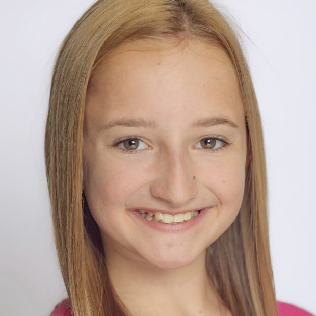 Girl with pink shirt smiling
