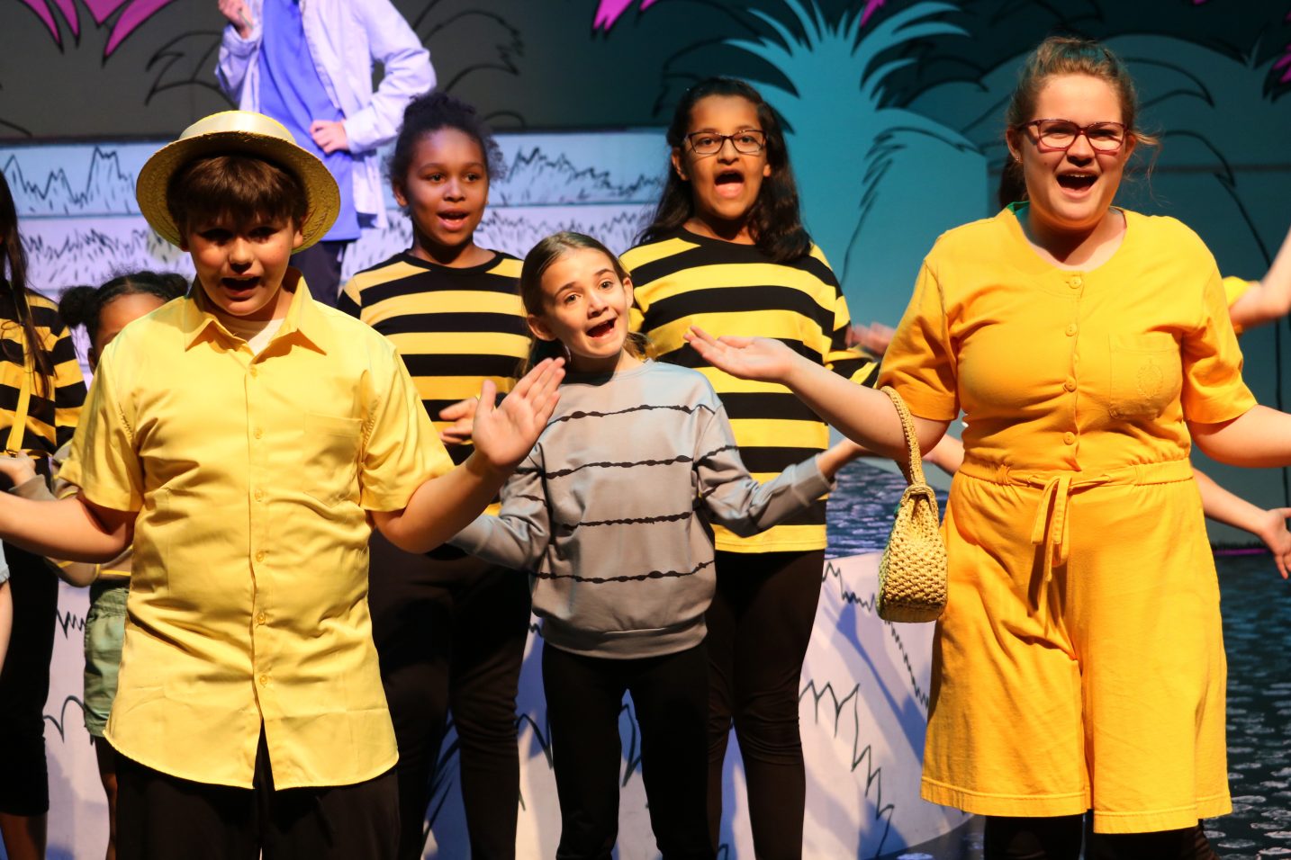 group of kid actors singing in costumes