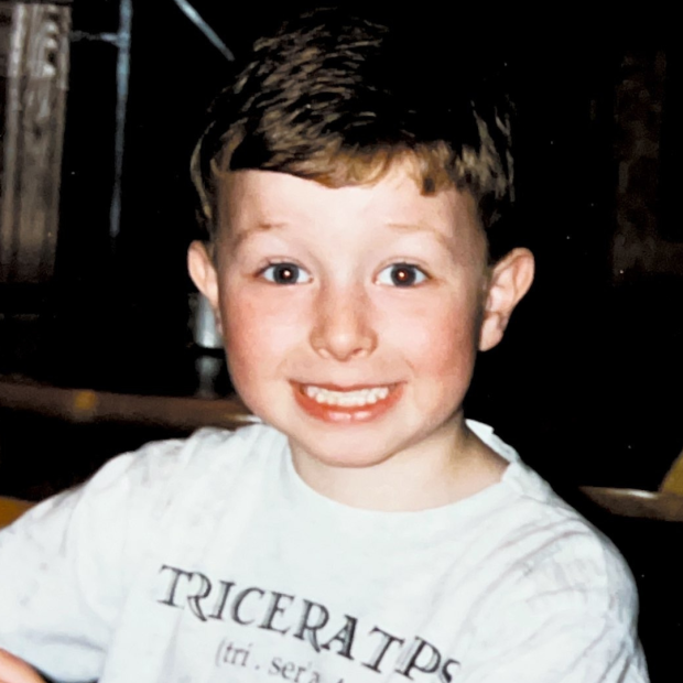 young boy in grey shirt