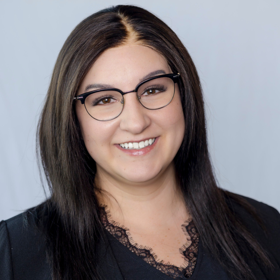 woman with glasses and black shirt