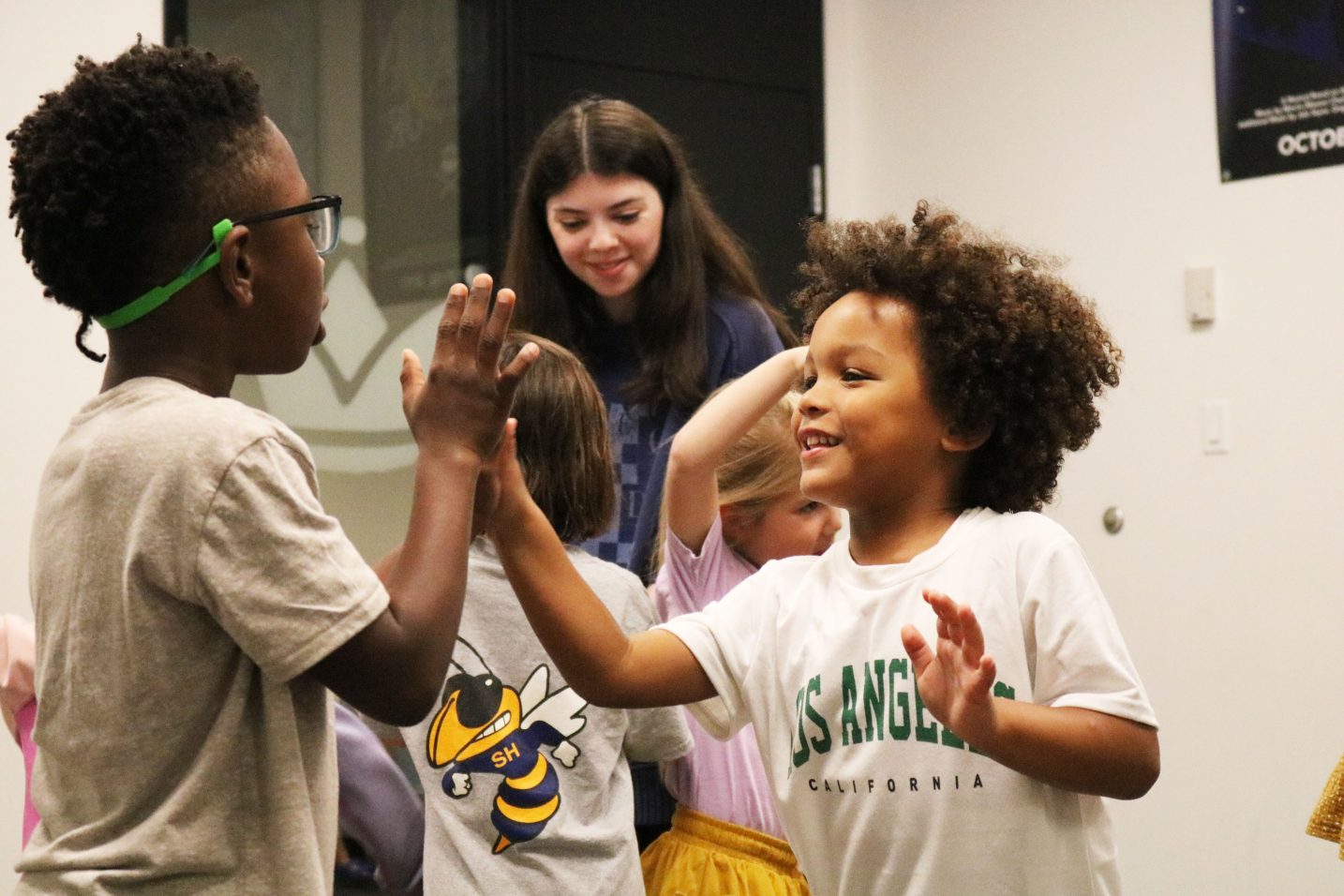 Two kids high-fiving